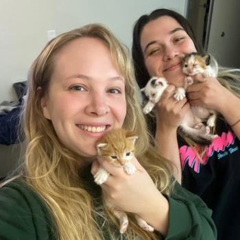 Emilie and Haley holding a litter of kittens